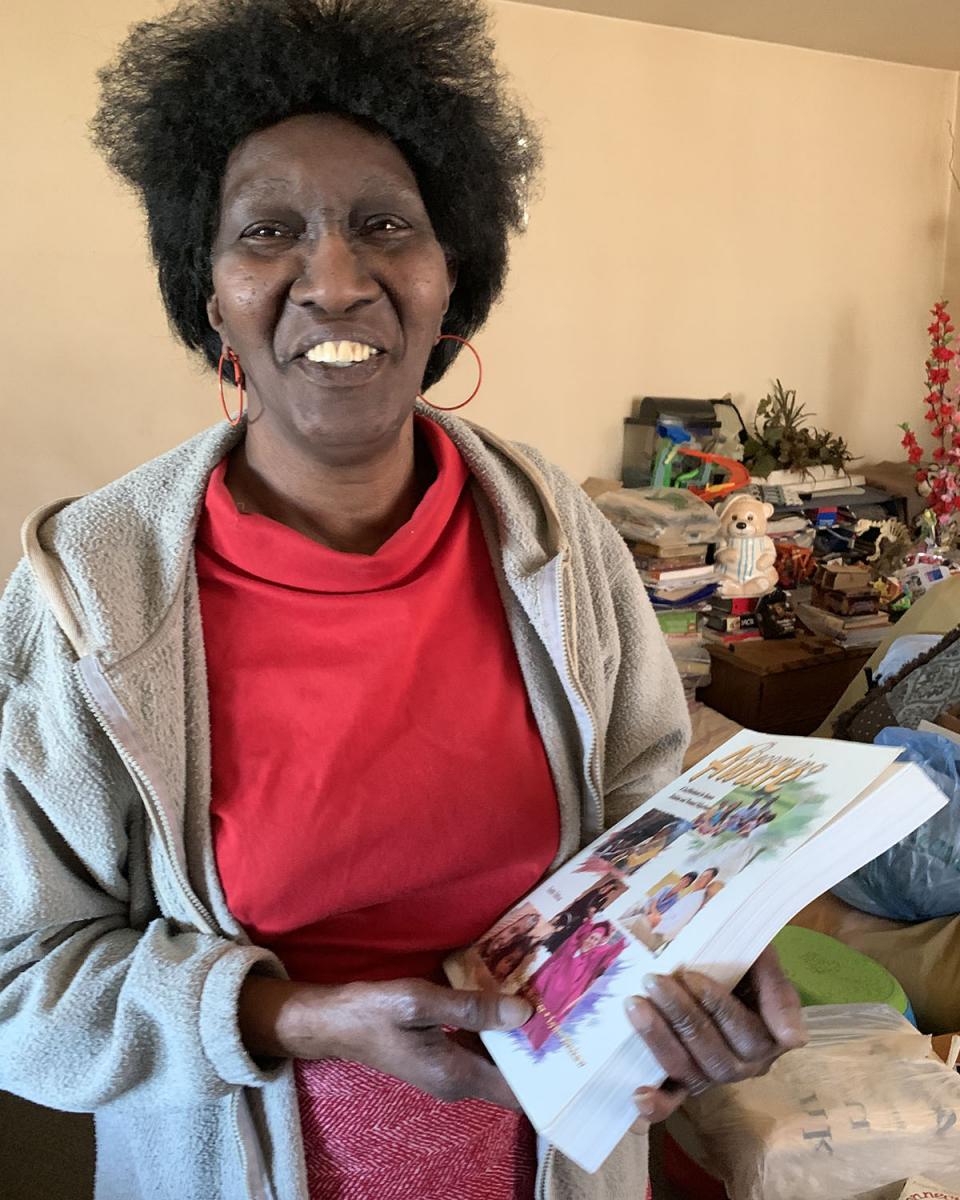 Antoinette holds one of her books